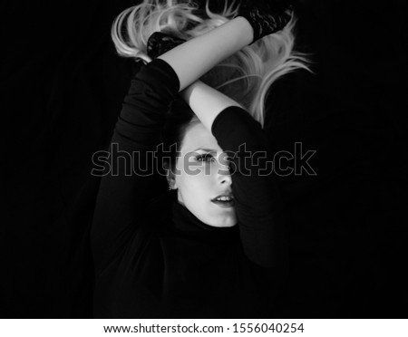 Similar – fashionable girl in black glasses sitting on an iron barrel