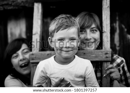 Similar – Mother with her seven year old daughter laughing in a cabin in the countryside.