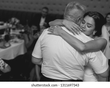 Black And White Portrait Dance Of The Bride With Father. Emotional Crying Girl Hugging Father On  Wedding Day .
Emotional Father Hugg Daughter On The Day Of Wedding. Tears Of Happiness On Brides Cheek