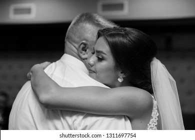 black and white portrait dance of the bride with father.Emotional crying girl hugging father on the day of wedding.
Emotional father hugg daughter on the day of wedding.tears of happiness in the bride - Powered by Shutterstock