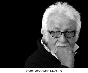 Black And White Portrait Of An Elderly Man With A Serious Expression.