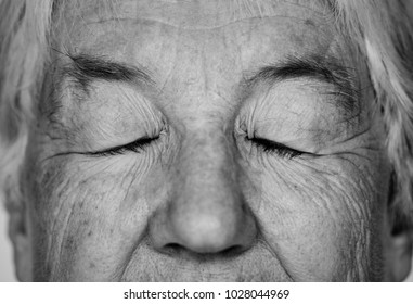 Black And White Portrait Of A White Elderly Woman Eyes Closed