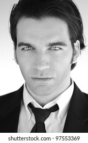 Black And White Portrait Of An Elegant Young Male Model In Suit And Tie