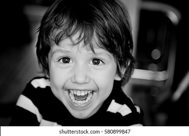 Black And White Portrait Of Happy Child  Toddler Boy Smiling And Laughing Close Up