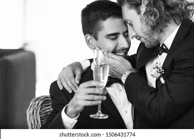 Black And White Portrait Of Happy Gay Couple On Their Wedding Day At Home