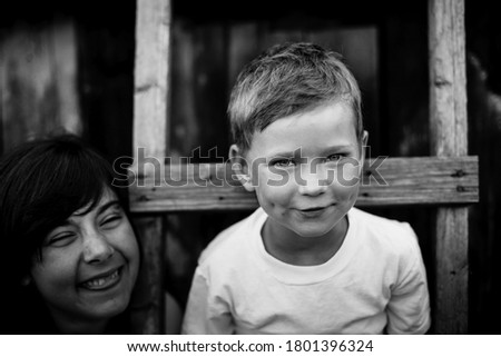 Similar – Mother with her seven year old daughter laughing in a cabin in the countryside.