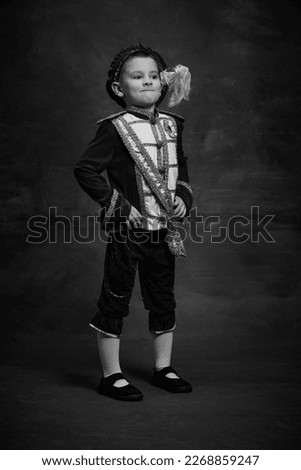 Similar – stylish little gentleman in hat looking up