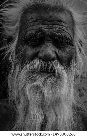 black and white portrait of an old man / monk / old bearded man