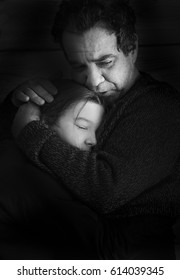 Black And White Portrait. Parting. Sad Father Hugs His Teen Daughter