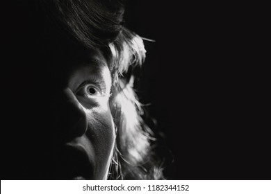 Black and white portrait  of a scared woman