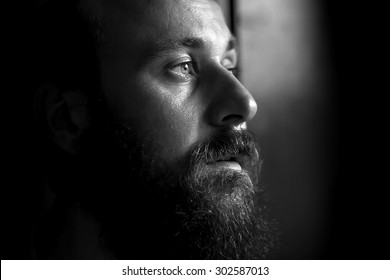 Black And White Portrait Of A Serious Man, Side View