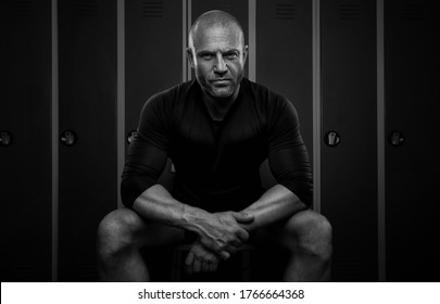 Black and white portrait of a sports man in the locker room