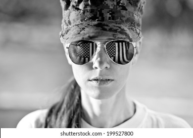 Black And White Portrait Of Us Army Woman With American Flag Reflection In The Sunglasses