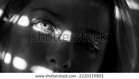 Image, Stock Photo Shadows of a blind fall on the face of a woman