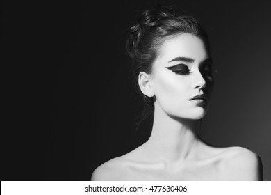 Black And White Portrait Of Young Beautiful Girl With Stylish Winged Eye Make-up 