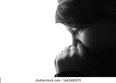 Black And White Portrait Of Young Sad Boy Crying With Sad Eyes. White Background. Free Space For Text. Tear On Cheek Of Unhappy Teenager.