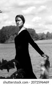 Black And White Portrait Of Young Woman Near Water