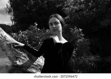 Black And White Portrait Of Young Woman Near Water