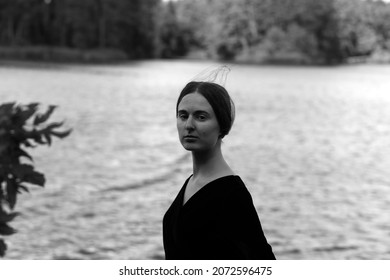 Black And White Portrait Of Young Woman Near Water