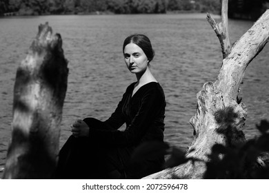 Black And White Portrait Of Young Woman Near Water