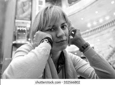 Black And White Portrait Of A Young Woman Talking On The Phone With  Annoyed Look At Her Face