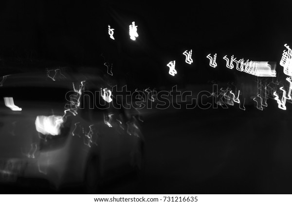 Black and\
white poster lights at night in a big city\
