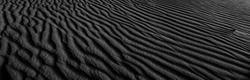 Black And White Poster Texture Sand In The Desert. Panaroma Sand Texture. Abstract Texture Line Wave. Sand Waves Abstract Black And White Background. Volcanic Rock Texture. Black Salt. Black Sand.