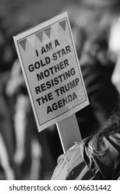 Black And White Protest Sign Stating I Am A Gold Star Mother Resisting The Trump Agenda.