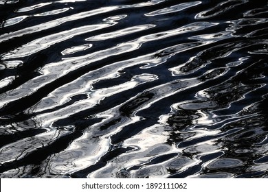 Black and white reflection in rippling water