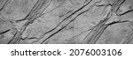 Black white rock texture. Mountain surface. Close-up. Gray stone background with copy space for design. Wide banner.	Panoramic.