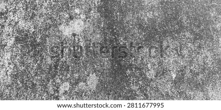 Black and white rough concrete texture background. Gritty monochrome stone or asphalt surface with high contrast grain.