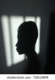 Black and white shadows of boy back window when sunlight at morning background