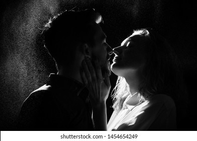 Black And White Silhouette Of A Kissing Couple