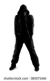 Black And White Silhouette Of A Male Dancer Posing With Dance Moves.  He Is Backlit And In Shadow To Show Off His Body Poses. 