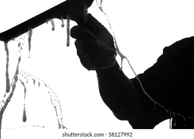 Black And White Silhouette Of A Window Washer Washing A Window