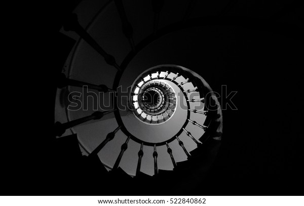 Black and white spiral\
staircase
