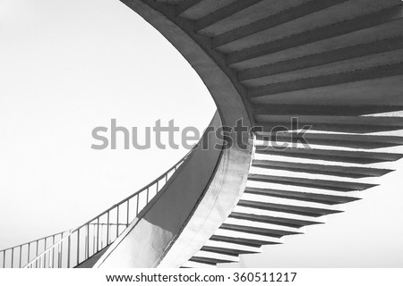 Black and white spiral stairs abstract. Round steps near the Gdanski bridge, Warsaw, Poland