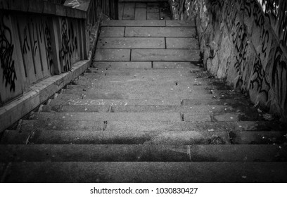 Black And White Stairs Going Down With A Lot Grafiti 