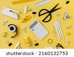 Black and white stationery on yellow background. School stationery supplies. Workplace organization. Concept back to school.	