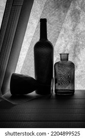 Black And White Still Life With Bottle, Vase And Glass