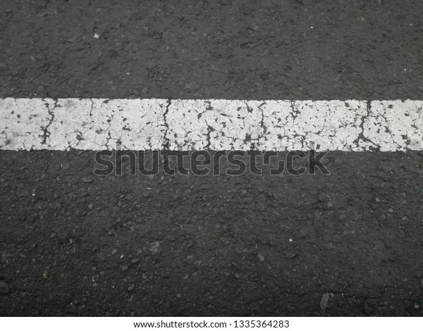 black\
and white street line with crack texture\
background