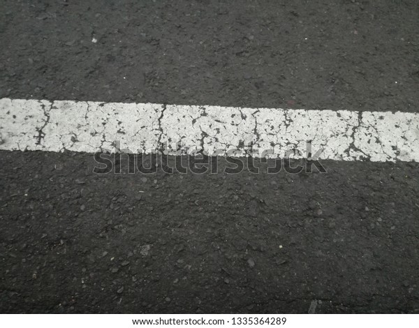 black\
and white street line with crack texture\
background