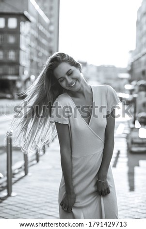 Similar – Woman looking from her balcony the city