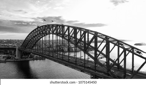 Black And White Sunset Aerial View Of Sydney Harbour Bridge, NSW - Australia.