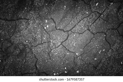 black and white texture of dry earth with cracks