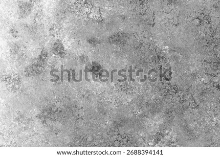 Black and white textured wall with dramatic mottled pattern and contrast