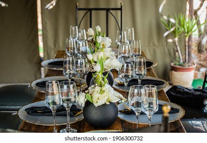 Black And White Themed Table Setup With Wine Glasses