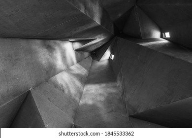 Black and White tone and mood, Detail of rough raw concrete ceiling with abstract geometric patterns with light and shadow of brutalist architecture church. - Powered by Shutterstock