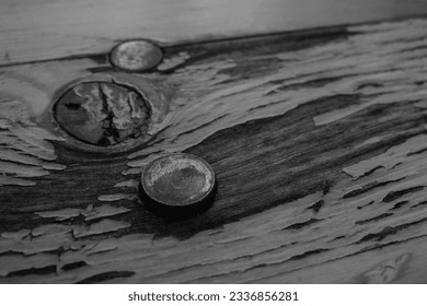 Black and white tone, Selective focus and close up at the old rust bolt or nail on the rough wooden.  - Powered by Shutterstock