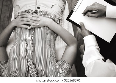 Black And White Top View Photo Of Young Woman Lying On Couch In Psychologist Office. Psychologist Taking Notes